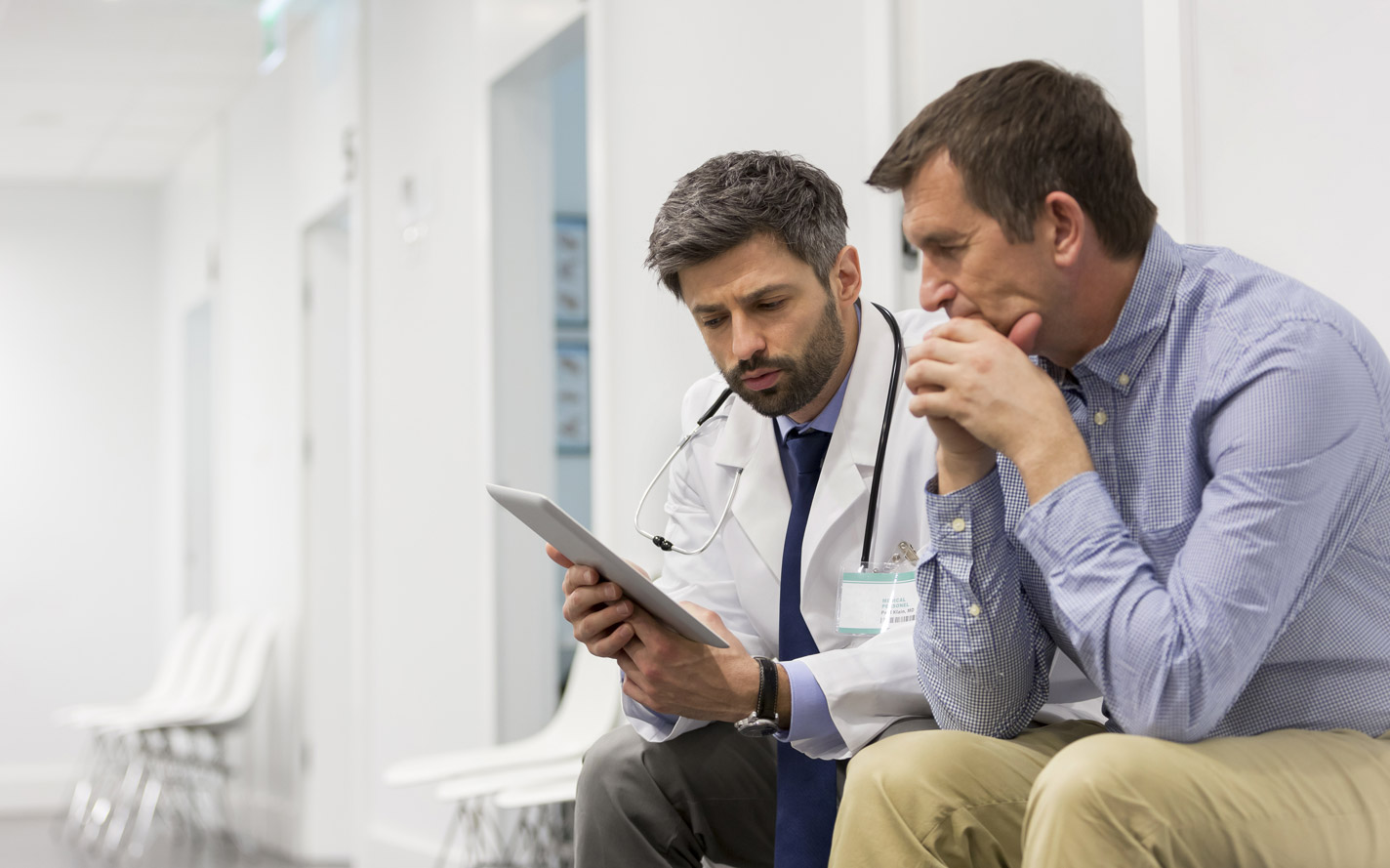 Doctor going over information with a patient.