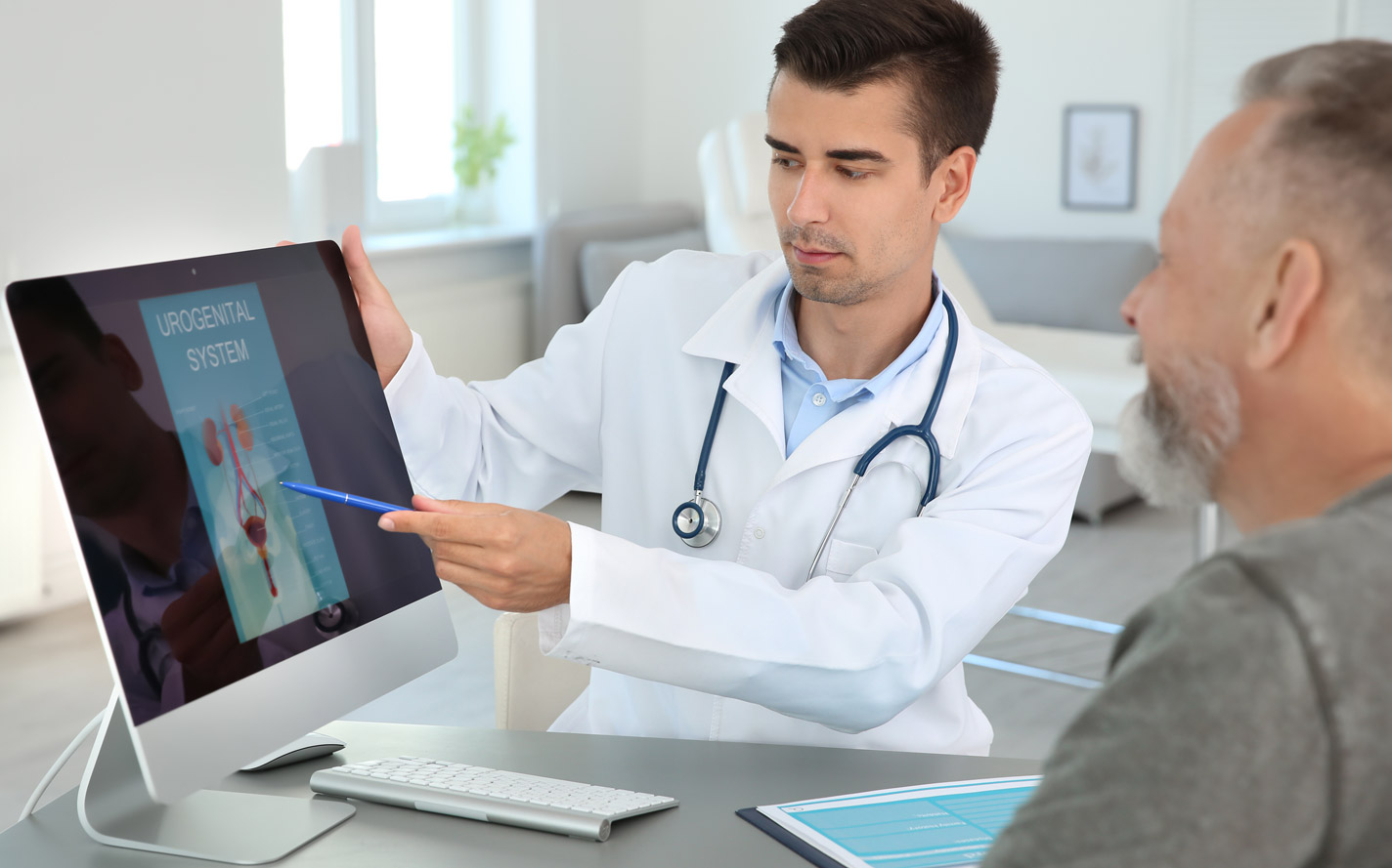 Doctor going over information with a patient.